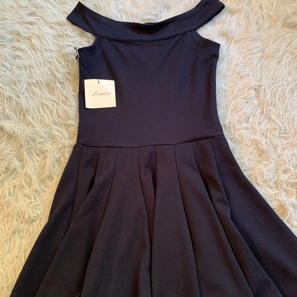 Bianca off-the-shoulder, flowy dress. Size small. Never worn with tags.